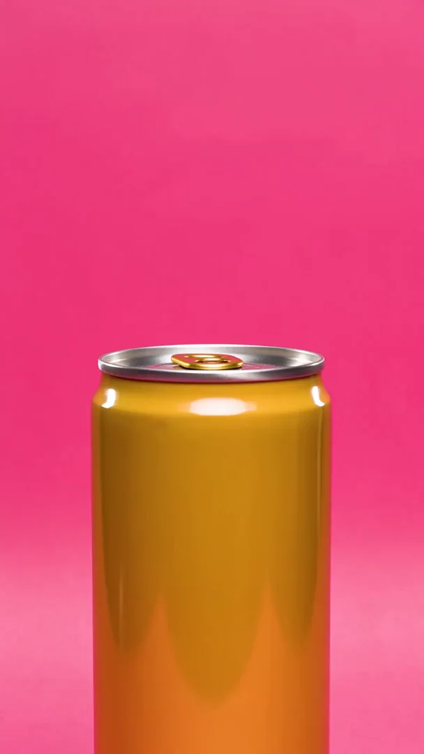 A yellow can on a hot-pink backdrop being cracked open